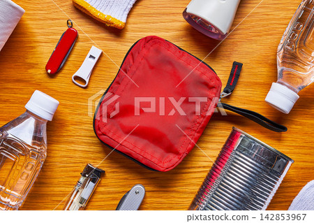 Disaster preparedness supplies on a wooden table 142853967