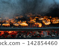 Delicious BBQ Chicken Wings Cooking on an Outdoor Charcoal Grill Delicious BBQ Chicken Wings Cooking on an Outdoor Charcoal Grill 142854460