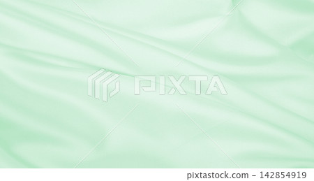 Smooth elegant green silk or satin luxury cloth texture as abstract background. Luxurious background design Smooth elegant green silk or satin luxury cloth texture as abstract background. Luxurious background design 142854919