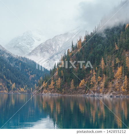 Scenery Jiuzhaigou national park in Sichuan, China. Beautiful Long lake and snow mountain in Autumn season. Famous Landmark and Vacation near Chengdu, China. Asia travel concept Scenery Jiuzhaigou national park in Sichuan, China. Beautiful Long lake and snow mountain in Autumn season. Famous Landmark and Vacation near Chengdu, China. Asia travel concept 142855212