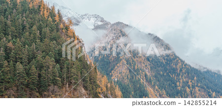 Scenery Jiuzhaigou national park in Sichuan, China. Beautiful Long lake and snow mountain in Autumn season. Famous Landmark and Vacation near Chengdu, China. Asia travel concept Scenery Jiuzhaigou national park in Sichuan, China. Beautiful Long lake and snow mountain in Autumn season. Famous Landmark and Vacation near Chengdu, China. Asia travel concept 142855214
