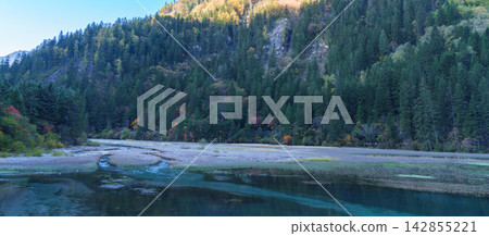 Scenery Jiuzhaigou national park in Sichuan, China. Beautiful of Arrow Bamboo Lake and snow mountain in Autumn season. Famous Landmark and Vacation near Chengdu, China. Asia travel concept Scenery Jiuzhaigou national park in Sichuan, China. Beautiful of Arrow Bamboo Lake and snow mountain in Autumn season. Famous Landmark and Vacation near Chengdu, China. Asia travel concept 142855221