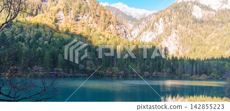 Scenery Jiuzhaigou national park in Sichuan, China. Beautiful of Arrow Bamboo Lake and snow mountain in Autumn season. Famous Landmark and Vacation near Chengdu, China. Asia travel concept Scenery Jiuzhaigou national park in Sichuan, China. Beautiful of Arrow Bamboo Lake and snow mountain in Autumn season. Famous Landmark and Vacation near Chengdu, China. Asia travel concept 142855223
