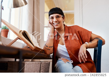 Happy, woman and fashion designer at desk for with notebook or journal for planning clothing ideas at house. Remote work, female person or smile for thinking or brainstorming creative project at home Happy, woman and fashion designer at desk for with notebook or journal for planning clothing ideas at house. Remote work, female person or smile for thinking or brainstorming creative project at home 142855825