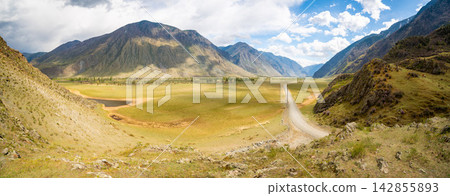 Aerial view of Chulyshman valley in Altai Russia surrounded by majestic mountains and wild nature Vast untouched landscape of Siberian wilderness Aerial view of Chulyshman valley in Altai Russia surrounded by majestic mountains and wild nature Vast untouched landscape of Siberian wilderness 142855893