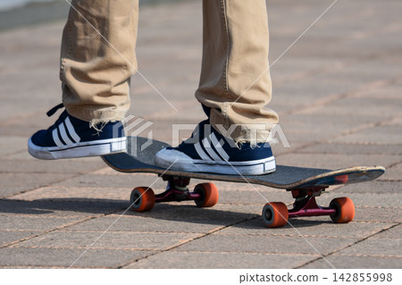 Sneakers and skateboard street style Sneakers and skateboard street style 142855998