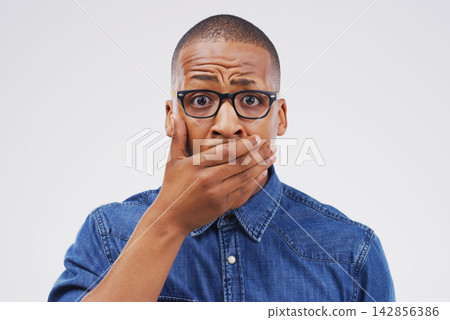 Studio portrait, black man and shock for gossip with wow, fake news and drama or secret announcement. African male person, surprised and oops emoji for mistake and reaction by white background Studio portrait, black man and shock for gossip with wow, fake news and drama or secret announcement. African male person, surprised and oops emoji for mistake and reaction by white background 142856386
