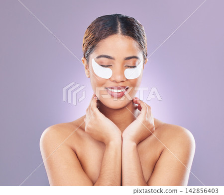 Studio, woman and eye mask with cosmetics for care with treatment and application for with face. Skin, products and glowing with natural look, review and wellness with confidence for clean pamper. Studio, woman and eye mask with cosmetics for care with treatment and application for with face. Skin, products and glowing with natural look, review and wellness with confidence for clean pamper. 142856403