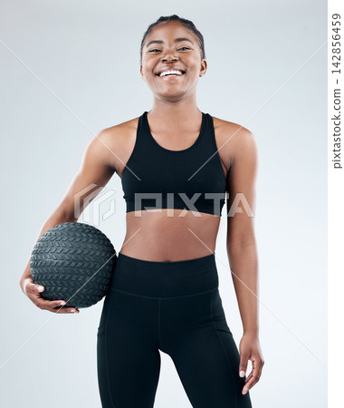 Portrait, black woman and smile with slam ball in studio on white background for fitness or exercise and health. Female person, happy and confident with workout, progress and results for wellness Portrait, black woman and smile with slam ball in studio on white background for fitness or exercise and health. Female person, happy and confident with workout, progress and results for wellness 142856459