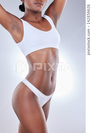Black woman, body and underwear in studio for wellness, health and fashion model aesthetic. Girl, lingerie and summer glow with confidence for fitness, transformation or beauty on white background Black woman, body and underwear in studio for wellness, health and fashion model aesthetic. Girl, lingerie and summer glow with confidence for fitness, transformation or beauty on white background 142856626
