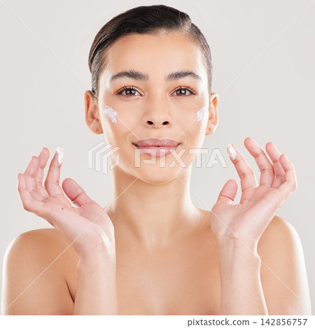 Portrait, cream and woman with dermatology, smile and aesthetic on a white studio background. Face, person and model with lotion, shine or creme with skincare, moisturizer and wellness with cosmetics Portrait, cream and woman with dermatology, smile and aesthetic on a white studio background. Face, person and model with lotion, shine or creme with skincare, moisturizer and wellness with cosmetics 142856757