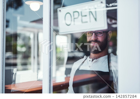Open sign, portrait and man in window at barbershop, salon and hairdresser in city. Small business owner, pride and male person ready for work, store and door for cosmetic startup in New York Open sign, portrait and man in window at barbershop, salon and hairdresser in city. Small business owner, pride and male person ready for work, store and door for cosmetic startup in New York 142857284