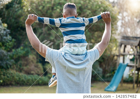 Shoulder, father or back of child in park for support in nature for care, safety or bonding together to relax. Holding hands, love or single parent dad with kid for security or growth in black family Shoulder, father or back of child in park for support in nature for care, safety or bonding together to relax. Holding hands, love or single parent dad with kid for security or growth in black family 142857482