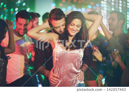 Couple, love and dance in club at night on date with romance in marriage or relationship. People, celebrate and embrace together with happiness at disco, party or rave at techno music with freedom Couple, love and dance in club at night on date with romance in marriage or relationship. People, celebrate and embrace together with happiness at disco, party or rave at techno music with freedom 142857483