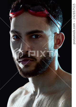 Portrait, swimmer or man ready for race competition, exercise or training on dark background. Start, development or athlete in swimming workout for fitness practice, wellness and sports in studio Portrait, swimmer or man ready for race competition, exercise or training on dark background. Start, development or athlete in swimming workout for fitness practice, wellness and sports in studio 142857515