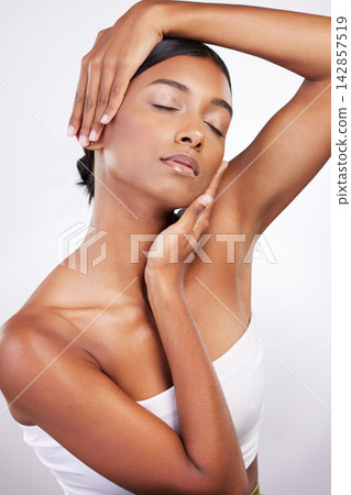 Skincare, woman and touch for beauty, dermatology and routine facial treatment. Spa, wellness and skin glow aesthetic on white studio background with black model, cosmetics and luxury collagen shine Skincare, woman and touch for beauty, dermatology and routine facial treatment. Spa, wellness and skin glow aesthetic on white studio background with black model, cosmetics and luxury collagen shine 142857519