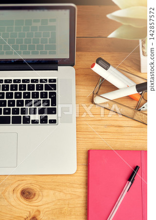 Top view, laptop and notebook on office desk with stationery for writing, planning and brainstorming ideas. Work table, tech and journal for creative design, social media blog and internet research Top view, laptop and notebook on office desk with stationery for writing, planning and brainstorming ideas. Work table, tech and journal for creative design, social media blog and internet research 142857572