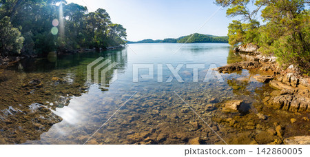 View of Veliko Jezero or Big Lake in Mljet National Park on Mljet Island in Croatia. Protected Mediterranean nature and peaceful lake landscape concept. 142860005
