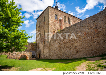 Interior courtyard and stone ruins of Tocnik Castle overlooking the Bohemian countryside. Medieval heritage and preservation concept Interior courtyard and stone ruins of Tocnik Castle overlooking the Bohemian countryside. Medieval heritage and preservation concept 142860643