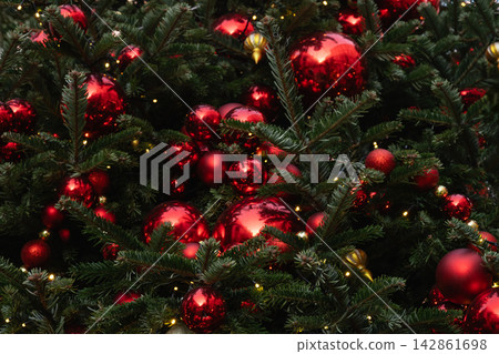 Details decorated Christmas tree with red ball, garland. Xmas card. Close up. Winter. Outdoor. 142861698