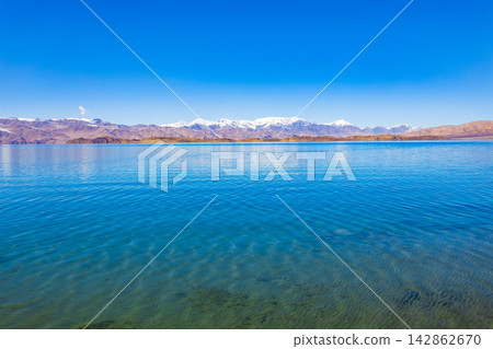 Karakul lake in the Pamir Mountains in Tajikistan Karakul lake in the Pamir Mountains in Tajikistan 142862670