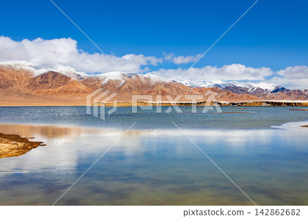 Shorkul lake and Pamir mountains near Murghab town, Tajikistan Shorkul lake and Pamir mountains near Murghab town, Tajikistan 142862682
