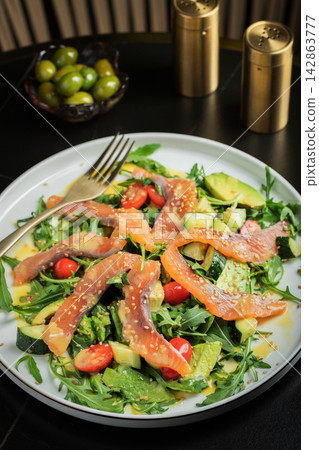 Salad with salted salmon and arugula Salad with salted salmon and arugula 142863777