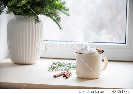 Cup of black coffee with winter decor on wooden table Cup of black coffee with winter decor on wooden table 142863852