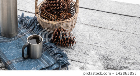 Hot coffee in winter outdoor setting Hot coffee in winter outdoor setting 142863855