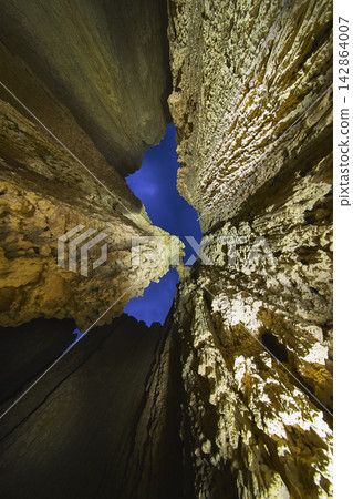 Cathedral Gorge Slot Canyon Walls with Blue Hour Sky and Dramatic Light Painting Cathedral Gorge Slot Canyon Walls with Blue Hour Sky and Dramatic Light Painting 142864007