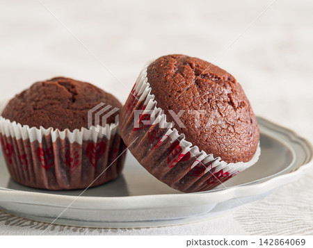 Cocoa muffins on a plate 142864069