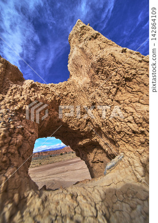 Cathedral Gorge Arch Formation with Dramatic Sky and Desert Landscape Perspective Cathedral Gorge Arch Formation with Dramatic Sky and Desert Landscape Perspective 142864109