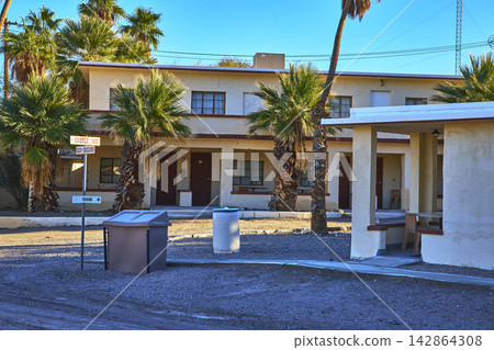 Desert Ghost Town Motel Palm Trees and Empty Courtyard in Zzyzx California Desert Ghost Town Motel Palm Trees and Empty Courtyard in Zzyzx California 142864308