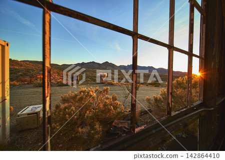 Abandoned Goldome Mill Window Desert Graffiti and Sunburst at Golden Hour Abandoned Goldome Mill Window Desert Graffiti and Sunburst at Golden Hour 142864410