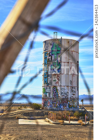 Abandoned Graffiti Water Tower Desert Landscape at Lake Dolores Water Park California Abandoned Graffiti Water Tower Desert Landscape at Lake Dolores Water Park California 142864413