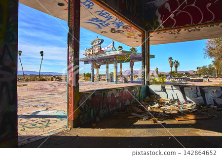 Abandoned Lake Dolores Water Park Graffiti Covered Building and Desert Palms California 142864652