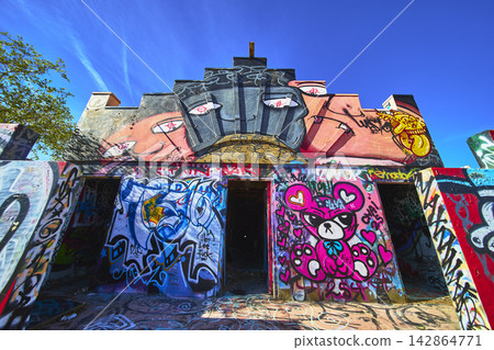 Abandoned Lake Dolores Water Park Graffiti Building Front in Vibrant Sunlight Abandoned Lake Dolores Water Park Graffiti Building Front in Vibrant Sunlight 142864771