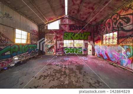 Abandoned Graffiti Covered Interior at Goldome Mill During Golden Hour Abandoned Graffiti Covered Interior at Goldome Mill During Golden Hour 142864829