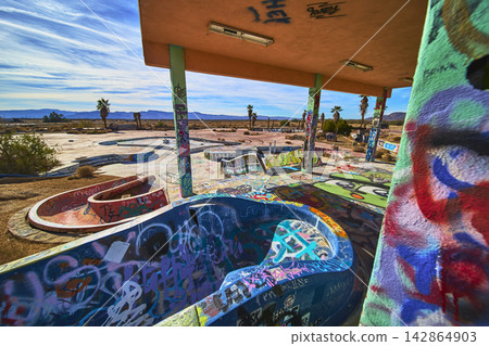 Abandoned Graffiti Covered Water Park Pools and Slides in California Desert Abandoned Graffiti Covered Water Park Pools and Slides in California Desert 142864903