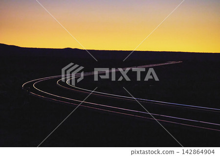 Curved Train Track at Golden Hour in Mojave Desert California Curved Train Track at Golden Hour in Mojave Desert California 142864904