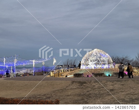 A dome of light shining on a hilltop and a nighttime outdoor illumination scene. A dome of light shining on a hilltop and a nighttime outdoor illumination scene. 142865703