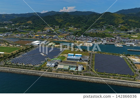 Aerial photograph capturing the coastal area, port, and solar panels of Awaji City, Hyogo Prefecture. Aerial photograph capturing the coastal area, port, and solar panels of Awaji City, Hyogo Prefecture. 142866036