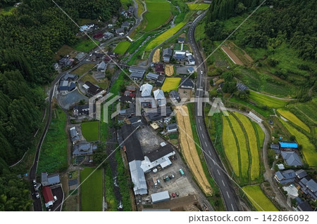 Aerial photograph capturing a rural settlement and rice paddies in Kusu Town, Oita Prefecture. Aerial photograph capturing a rural settlement and rice paddies in Kusu Town, Oita Prefecture. 142866092