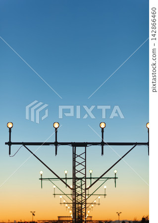Airport runway lights at sunset Airport runway lights at sunset 142866460