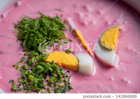 Pink beet soup close angled view with egg and herb Pink beet soup close angled view with egg and herb 142866880