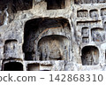 Stone Buddhas carved in the Longmen Grottoes 142868310