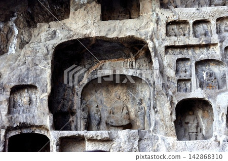 Stone Buddhas carved in the Longmen Grottoes Stone Buddhas carved in the Longmen Grottoes 142868310