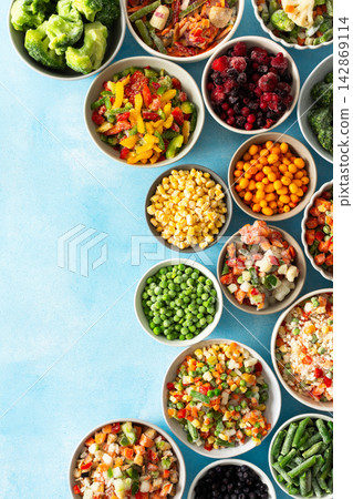 Various frozen veggies such as peas, carrots, and beans preserved in plates, a fresh and practical solution for winter meal preparation and healthy living, vegetables in plates on a blue background Various frozen veggies such as peas, carrots, and beans preserved in plates, a fresh and practical solution for winter meal preparation and healthy living, vegetables in plates on a blue background 142869114