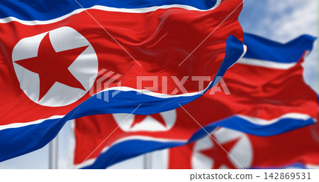 Close-up of North Korea national flags waving in the wind on a clear day 142869531