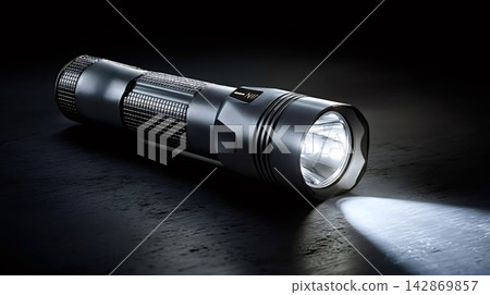 Tactical led flashlight illuminating dark surface with bright beam Tactical led flashlight illuminating dark surface with bright beam 142869857